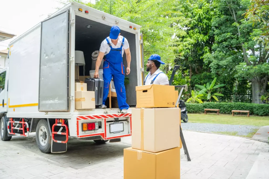 E Dubai Movers crew getting a truck ready for a booked move