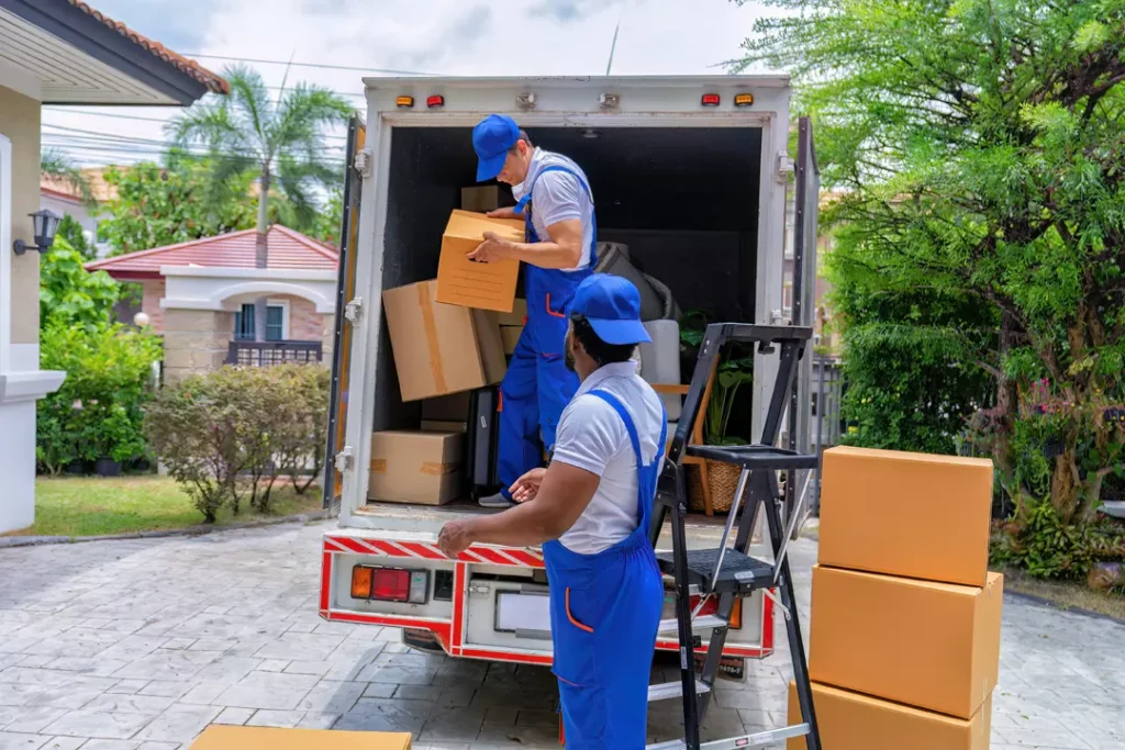 Movers and packers unloading a truck in Dubai
